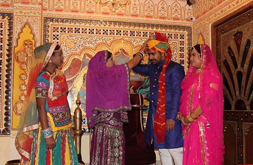 Royal welcome with tika and petals for wedding guests at Virasat Jaipur